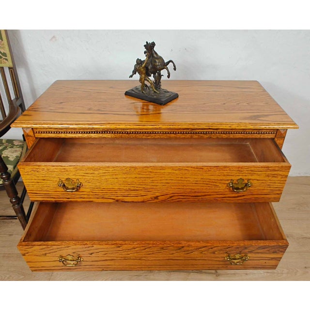 This is a gorgeous vintage Oak chest of drawers that is sure to exude a wonderful country charm to the home setting. Circa...