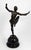 This original Art Deco bronze sculpture depicts a female dancer captured mid-motion in a pose with outstretched arms and...