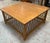 Beautiful vintage coffee table made in the Philippines, featuring a warm wood-tone rectangular/square top and an intricate...