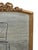 The product is a vintage 1920 French gilded Beveled edge mirror, featuring a rectangular shape and a gold frame finish...