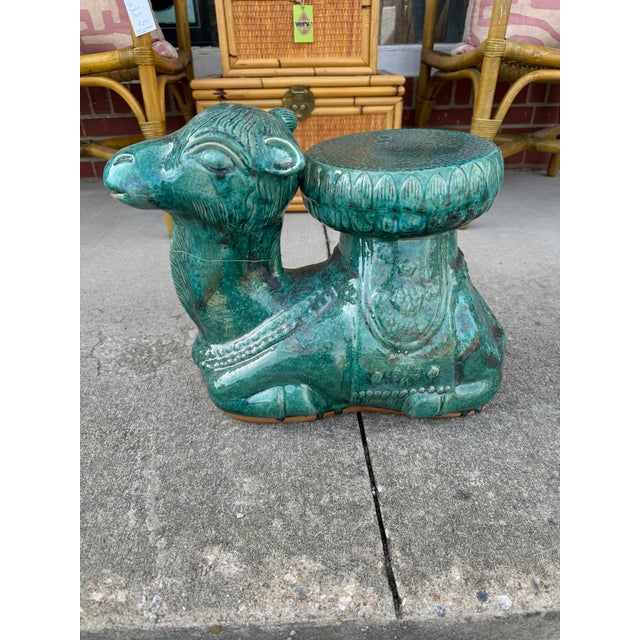 Such an unusual “baby” camel garden stool from color to size! Great for stacking books or adding that pop of color....