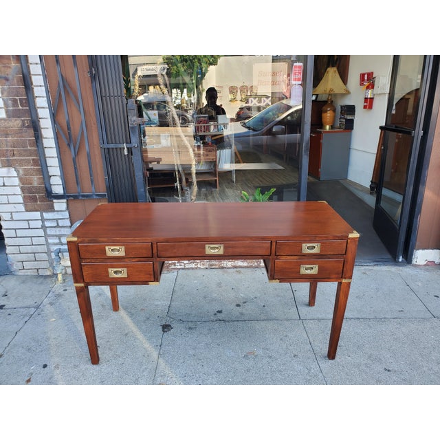 Vintage probably late 50s campaign style desk. The desk features five fully functional drawers. The top three drawers are...