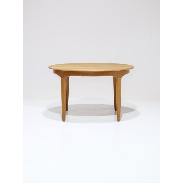 Rare and exceptionally long extendable dining table (model 62), designed by Henning Kjaernulf for Sorø Stolefabrik in...