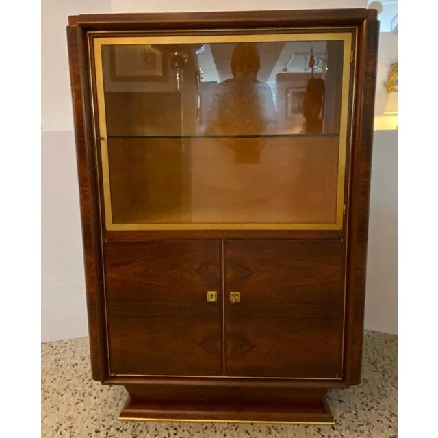 French Art Deco 1930s Christian Krass style Display Cabinet from a Palm Beach estate. This stylish and chic French art...