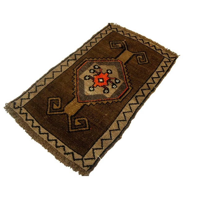 Vintage Handknotted decorative mini rug from Kars region of Turkey. Approximately 45-55 years old. In very good condition.
