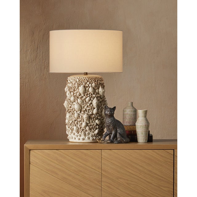 The coastal vibes of the Corfu Ivory Table Lamp are created by the tremendous amount of effort that into the surface...