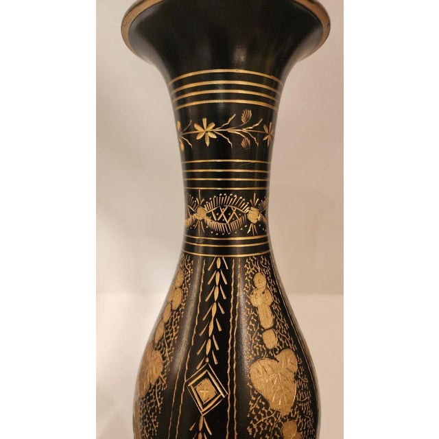 This listing features a small brass vase that has been hand-engraved to reveal the gold underneath the black coating,...