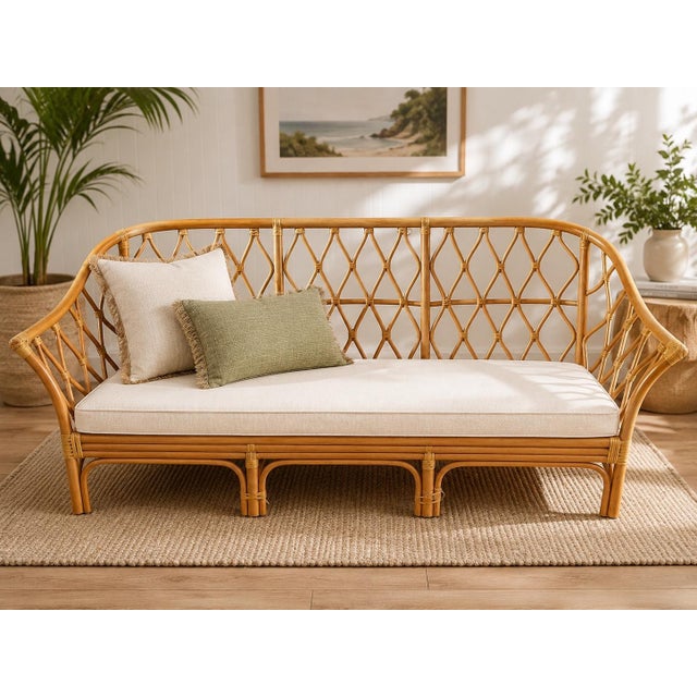 A beautifully crafted vintage rattan sofa showcasing timeless organic design and exceptional handcrafted construction....