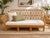 A beautifully crafted vintage rattan sofa showcasing timeless organic design and exceptional handcrafted construction....