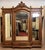 Louis XVI style walnut armoire, circa 1850 3 mirrored doors and 3 drawers decorated with period carvings open columns...