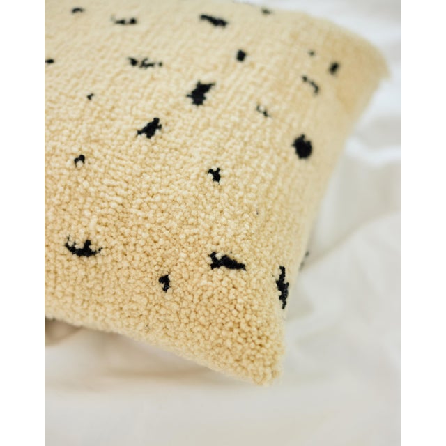 Dotted Ivory Wool Cushion by Tiktik, 2010s, in Flawless conditions. Designed from 2000 This piece has an attribution mark,...