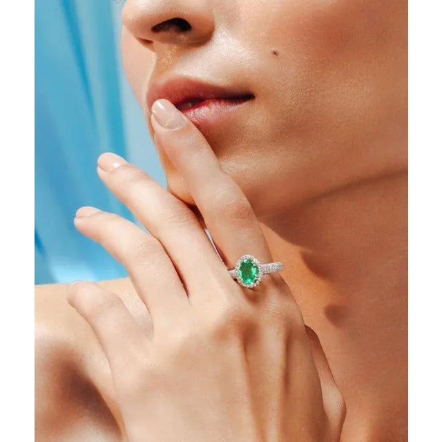 This is part of Chairish’s Fine Jewelry assortment. Glamorous Emerald and Diamond Engagement Ring in 18K Gold featuring...