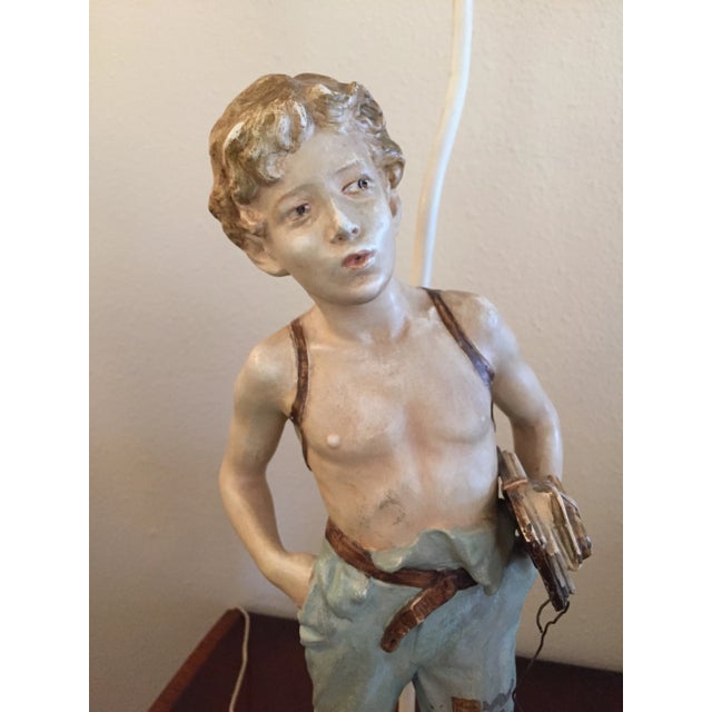 Antique sculpted painted metal boy figure lamp. Signed and one of a kind. Purchased from a Georgetown antique store in...