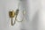 Pair of wall sconces attributed to Stilnovo. The structure is in brass and iron. They were stock funds so never used. We...