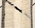 Sophisticated hand-knotted wool rug with a striking Midnight Black abstract pattern on an Ivory base, offering a...