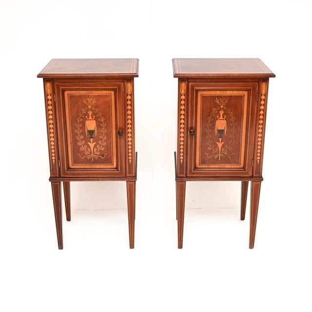 An exceptional pair of antique Edwardian inlaid bedside cabinets. They were made in England, they date from the 1900-1910...