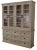 This modern double bookcase is crafted from tall solid wood, featuring four glass doors and functioning as a vitrine,...