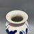 Beautiful Chinese porcelain vase with raised relief blue lotus flowers and foliage. Deep cobalt blue blooms stand...