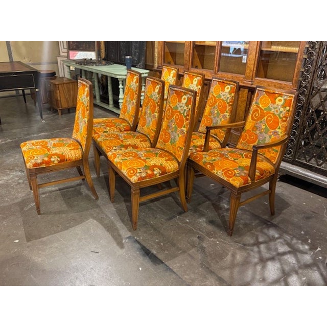 This product is a set of 8 black lacquered pecan dining chairs featuring Jack Lenor Larsen fabric. These handsome chairs...