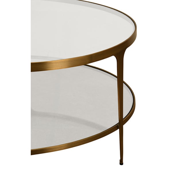 New special order item. Not vintage. Elevate your living room with the Stacey Antique Brass Coffee Table, a sophisticated...