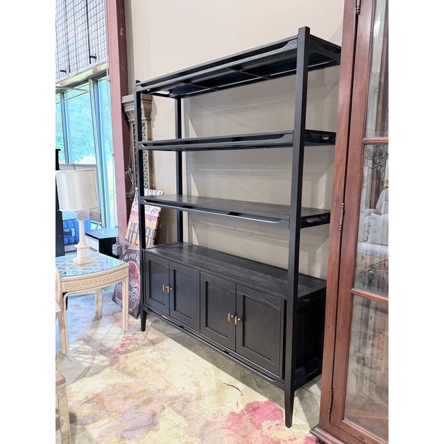 The Brock Bookcase by Arhaus is a refined storage piece that balances clean architectural lines with warm natural...