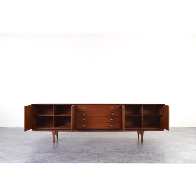 This teak sideboard was designed in the 1960s by Norwegian designers Rolf Rastad and Adolf Relling and manufactured by...