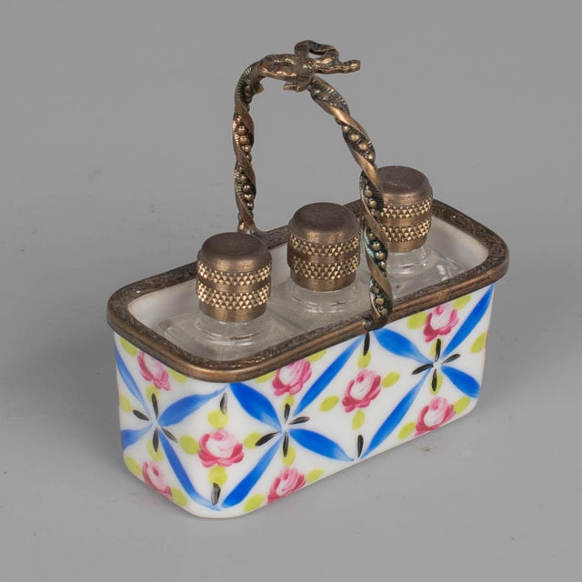 A set of five Limoges French miniature collectible porcelain trinket boxes, each with hand-painted decoration and brass...