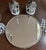 Beautiful 14” round vintage mirror/glass plateau stand tray with SilverPlate floral feet. quails and candles are sold...