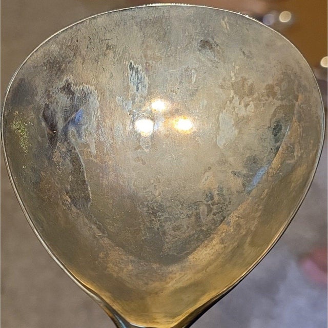 International Silver Company vintage gravy ladle measuring 11.5 inches, featuring a silver-plated finish with a gold tone...