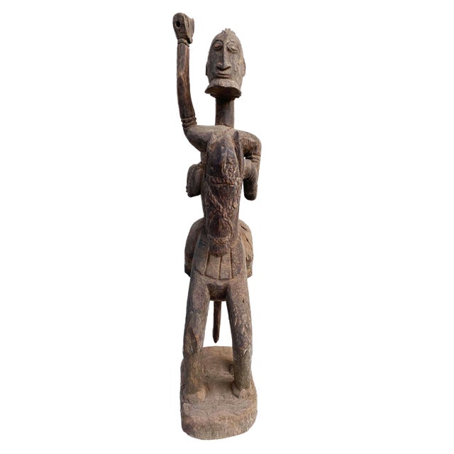 Superb and rare hand-carved wooden horseman from Mali. Measuring 30" in height and made from a single piece of wood, this...
