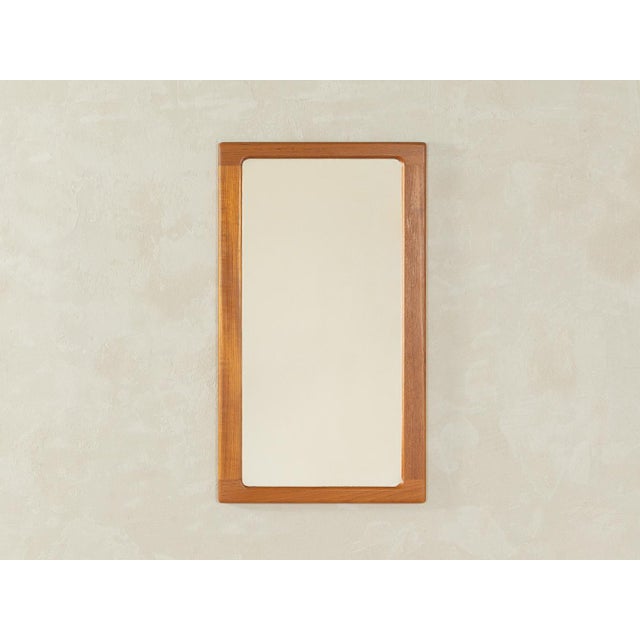 Classic mirror from the 1960s with a high-quality solid teak wood frame. Made in Denmark, manufacturer: CFC Silkeborg...