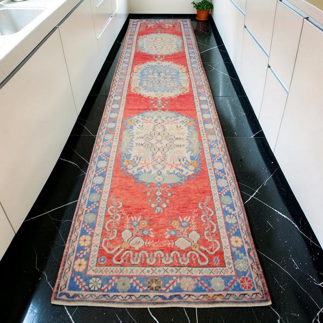 Woven originally for personal use by village artisans in the Güney district of Denizli, this stunning hand-knotted runner...