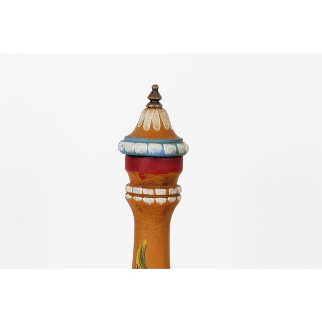 Vintage Italian wooden pepper mill in the Alpine folk art tradition, with a cluster of hand-painted flowers, accented by...