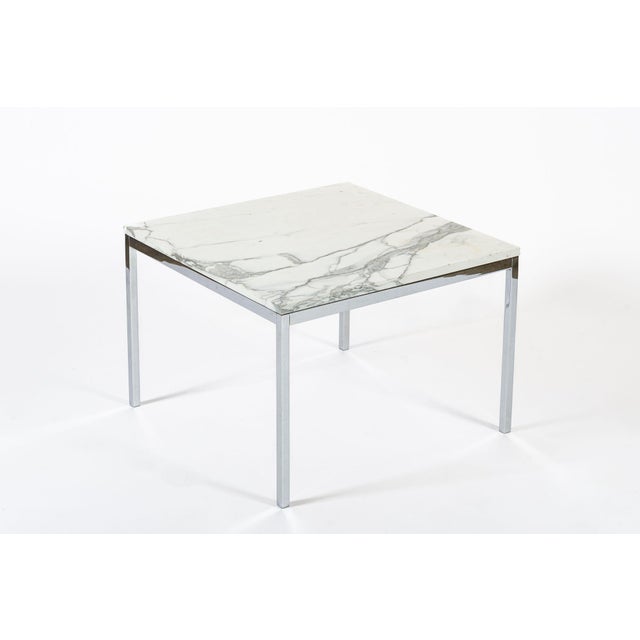This vintage mid century modern square white marble side table or coffee table designed by Florence Knoll is circa 1960....
