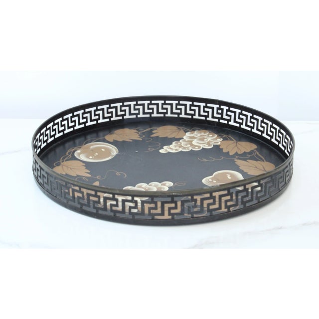 MCM hand-painted tole tray with trailing leaf motif. Exposed Greek key pattern around the rim. Care: hand-wash Want to...