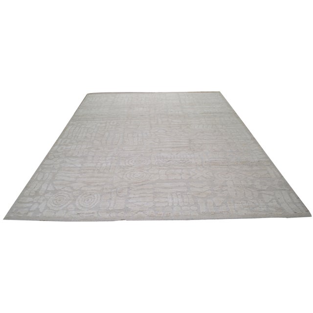 Hand-knotted with care using traditional rug making techniques, this wool rug blends timeless craftsmanship with a modern...