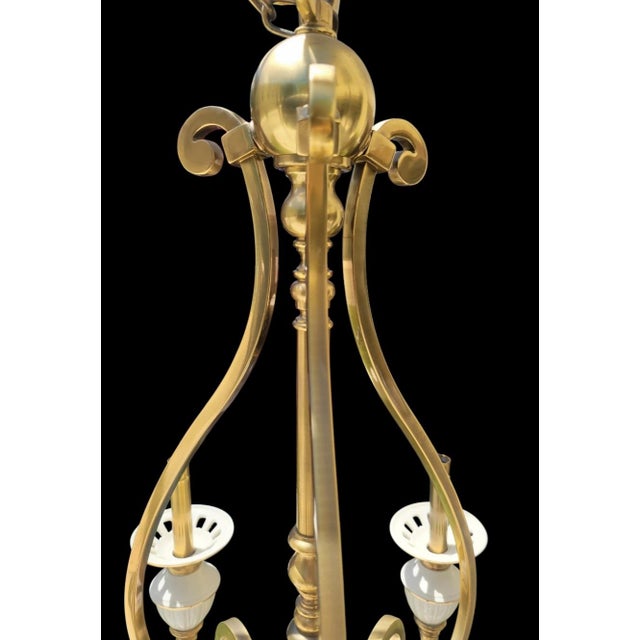 Elevate your space with classic elegance and refined craftsmanship. This striking 6-arm chandelier by Lenox blends creamy,...
