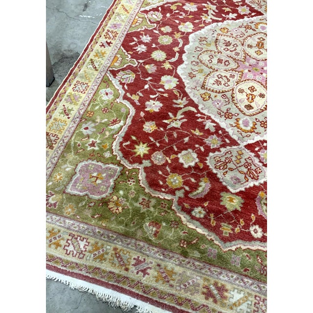 Handmade vintage Turkish Oushak rug in traditional design and natural dyes. The rug is from the beginning of 20th century...