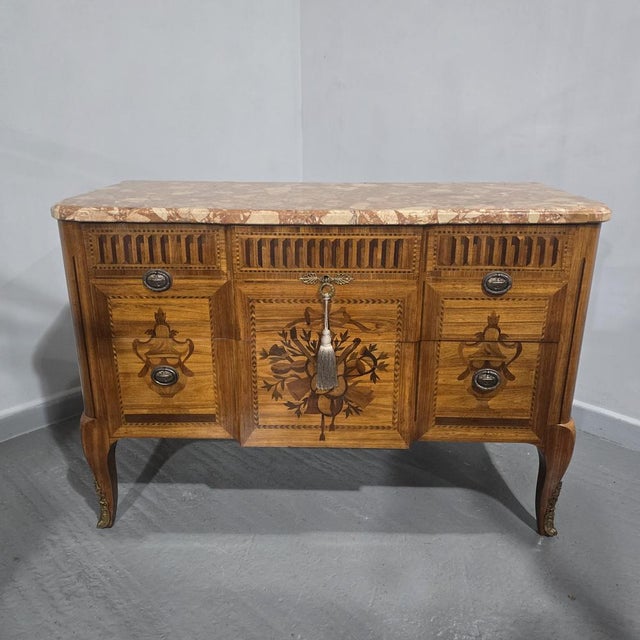 A fine French inlaid breakfront chest of two drawers, marquetry inlay to three sides, outstanding shaped marble top,ormolu...