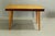 A minimalist Jitona extendable table, with beech legs and a top veneered with decorative light-stained ash veneer and...