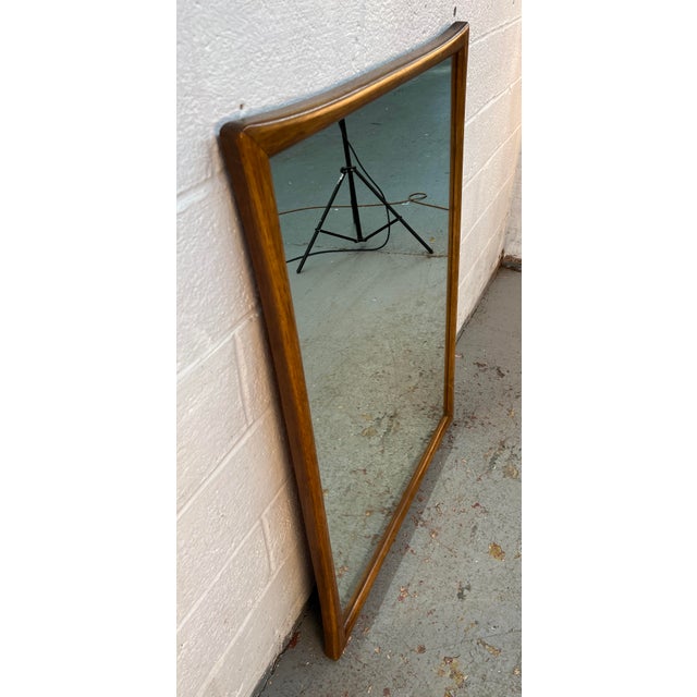 Bring timeless Mid-Century style to your home with this beautiful Vintage Mid-Century Walnut Sculpted Wall Mirror....