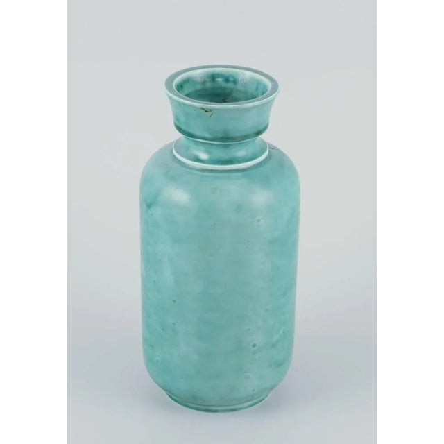 Wilhelm Kåge for Gustavsberg, large stoneware vase. “Argenta” series. Hand-turned, glazed in green tones. Marked. Mid-20th...