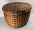 We are offering this large covered Northeast Indian basket. This basket has polychrome woven splint design, probably ash,...