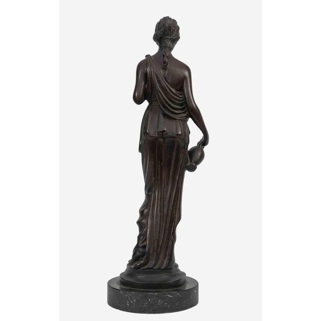 Vestal with Jug is an original modern sculpture realized by an italian Artist of the early 20th Century. Bronze sculpture...