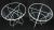 Pair of Mid-Century Modern round wire base folding cafe tables with glass tops on ball feet.