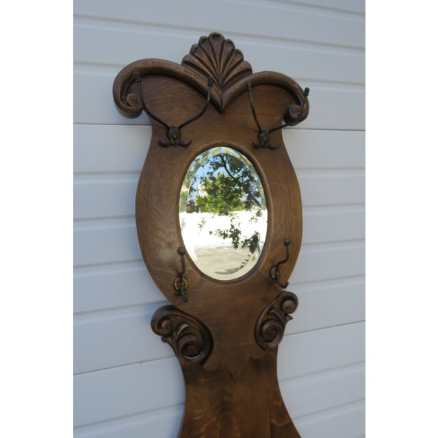 Early 1900s Victorian Carved Oak Hall Tree Coat Hat Stand With Mirror and a Seat For Sale - Image 4 of 12