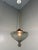 Hanging lamp High Chapparal by Raak Amsterdam, Netherlands (marked). Grey smoked glass shade with a brass cover, 3 small...