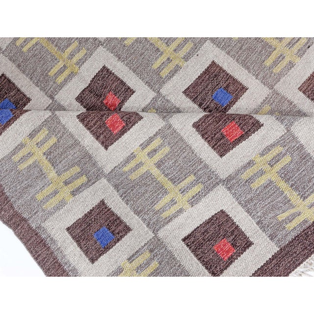 Vintage Swedish flat woven rug. Size: 5'5" × 8'6" (165 × 259 cm) This vintage Swedish flat-woven rug showcases a refined...