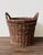 A substantial, handwoven wicker basket with an internal iron wire frame for structural integrity. Originally used in a Los...