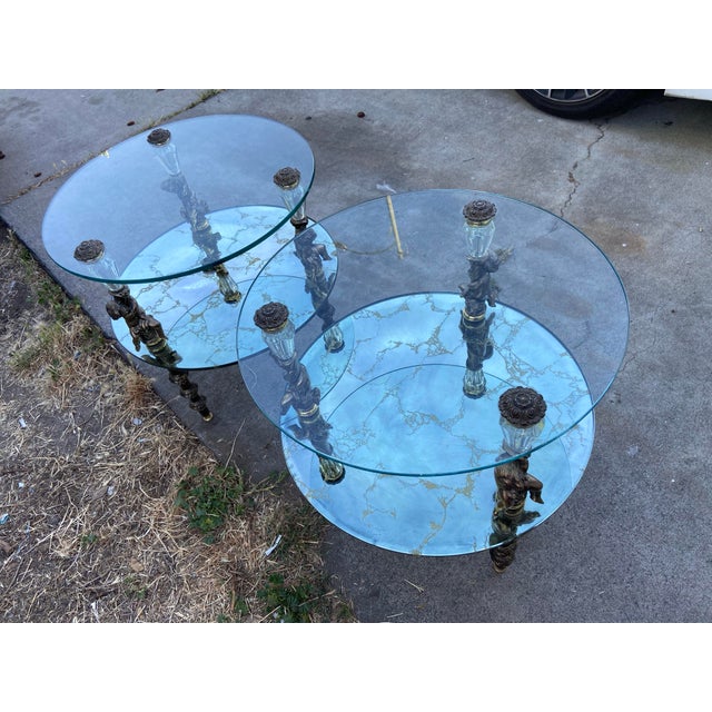 The Hollywood Regency Goran of Belgium End Table Set of Two is a stunning addition to any room, featuring a round glass...